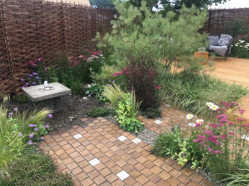 Paving and plants blur into each other